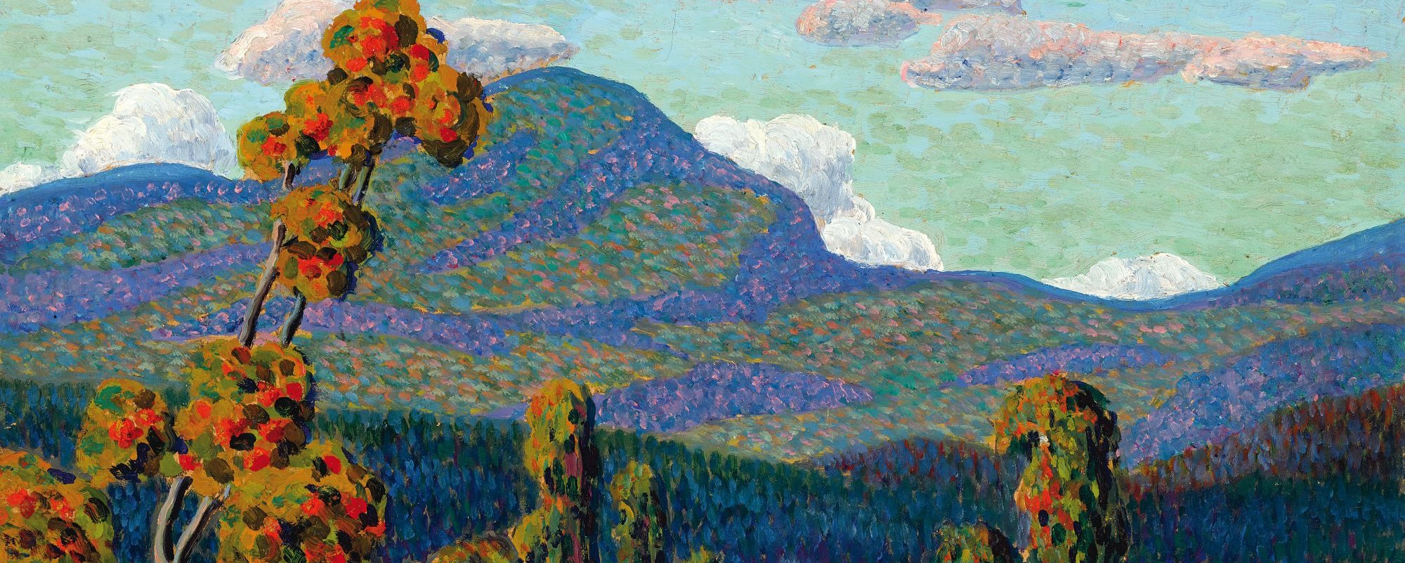 A landscape with a tree with red leaves or fruit in the foreground with a green mountain in the background and a lake in the middle