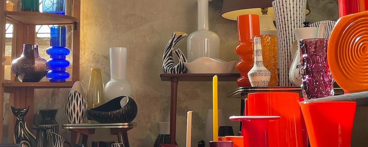 A market stall with ceramics and glass vases
