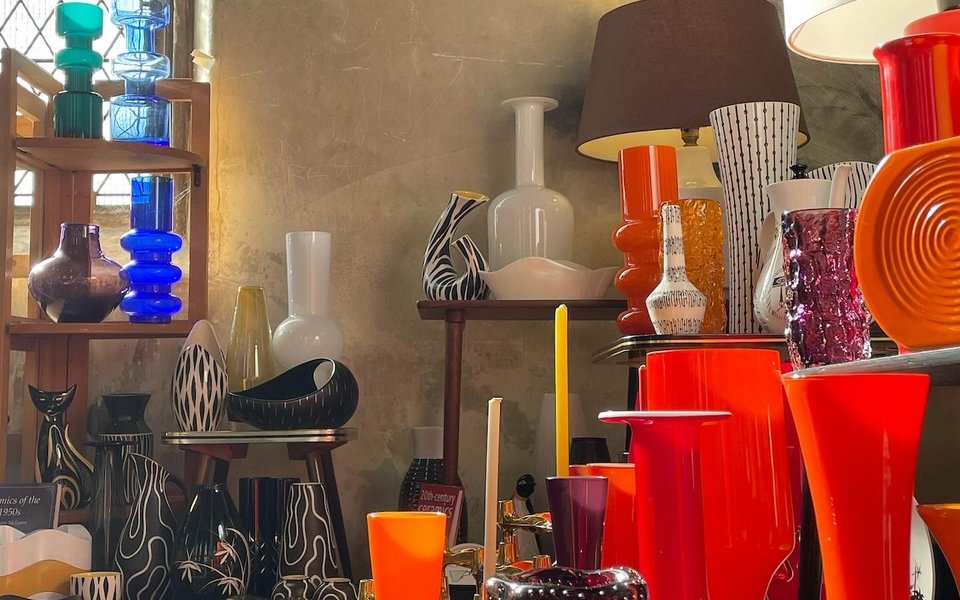 A market stall with ceramics and glass vases