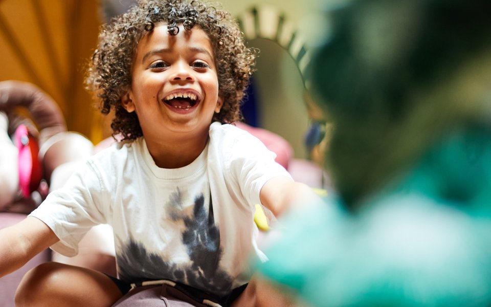 Child playing on cushion