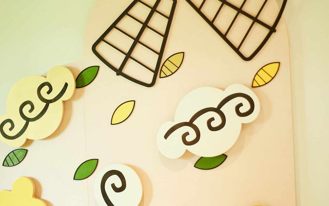 A windmill decoration mounted on a wall