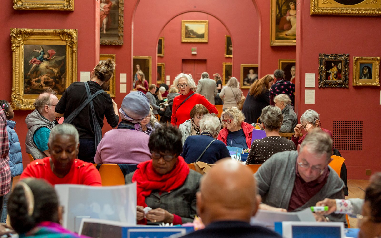 Dulwich Picture Gallery full of older people crafting at tables