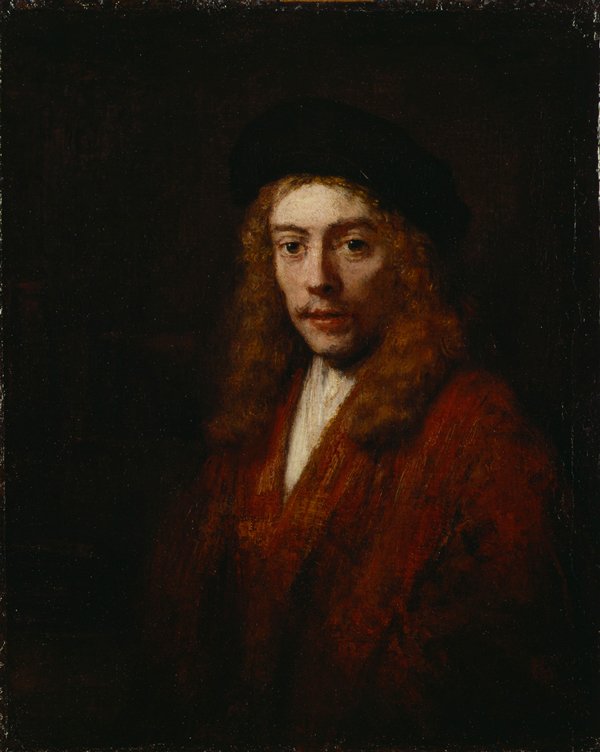 Portrait of a man with long curly brown hair wearing a black hat and red brown jacket with a white shirt.