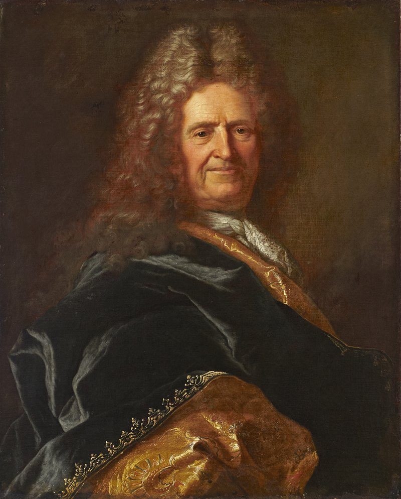 Portrait of a man with a large brown long haired wig