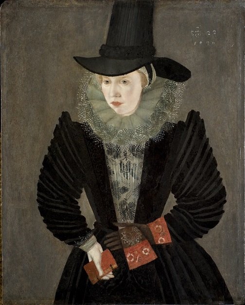 Portrait of a person wearing an elaborate black dress with puffed sleeves, a tall black hat, and a detailed lace ruff collar.