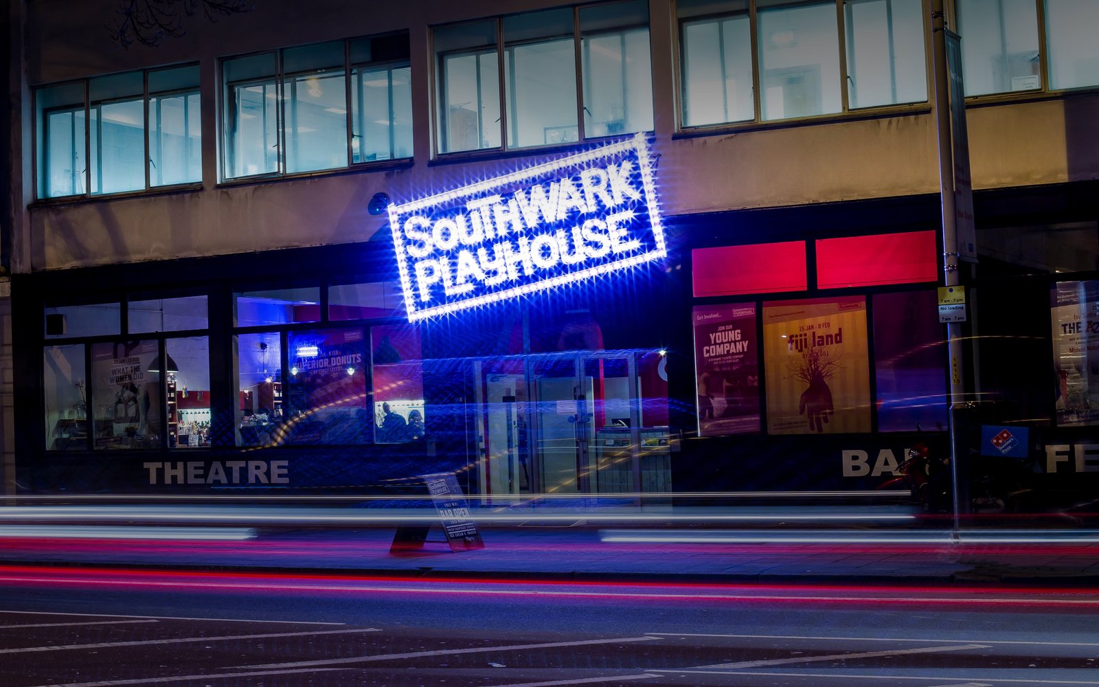 Front of a building with Southward Playhouse in large lit letters