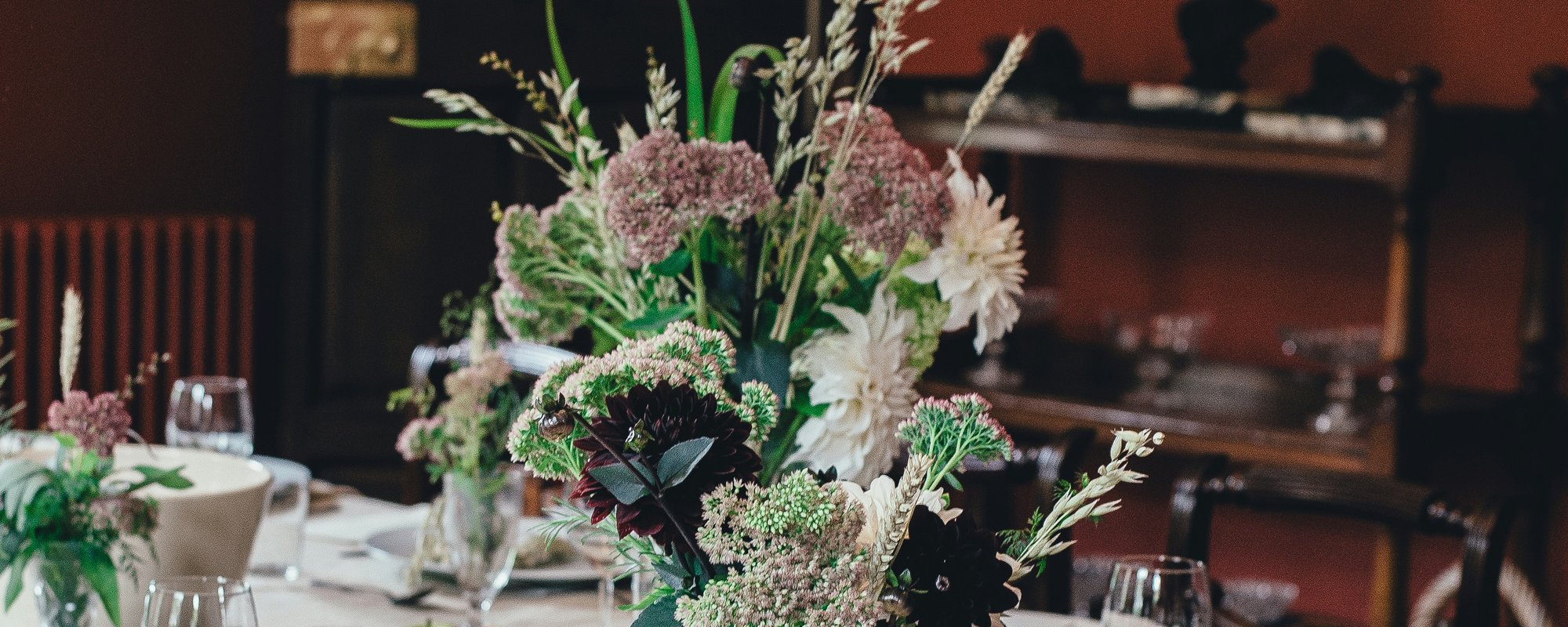 A table laid with glasses and flowers