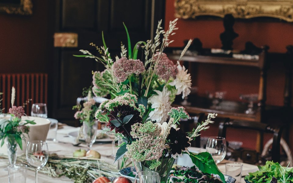 A table laid with glasses and flowers