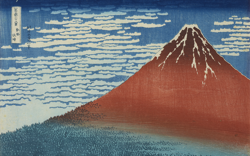 Woodblock print of Mount Fuji in red with snow top with a cloudy sky and trees below.
