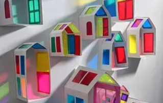 Model houses made with card and coloured plastic for the windows
