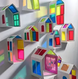 Model houses made with card and coloured plastic for the windows